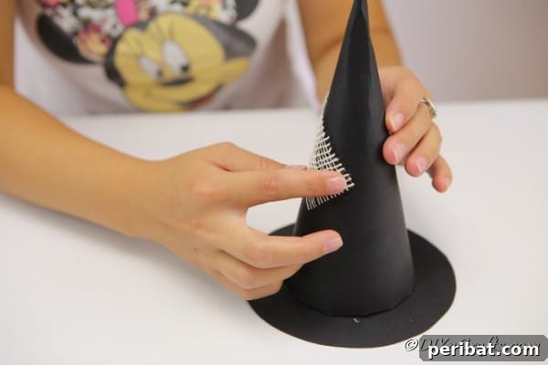 Bewitching DIY Witch Hat for Halloween 18 Adding frayed gauze to the witch hat