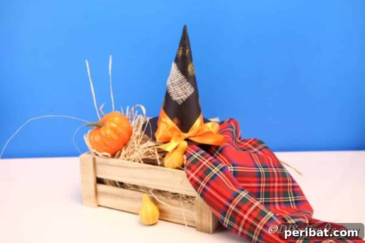 Bewitching DIY Witch Hat for Halloween 3 Rustic DIY witch hat sitting on a vintage basket alongside mini pumpkins, ideal for Halloween mantle decor