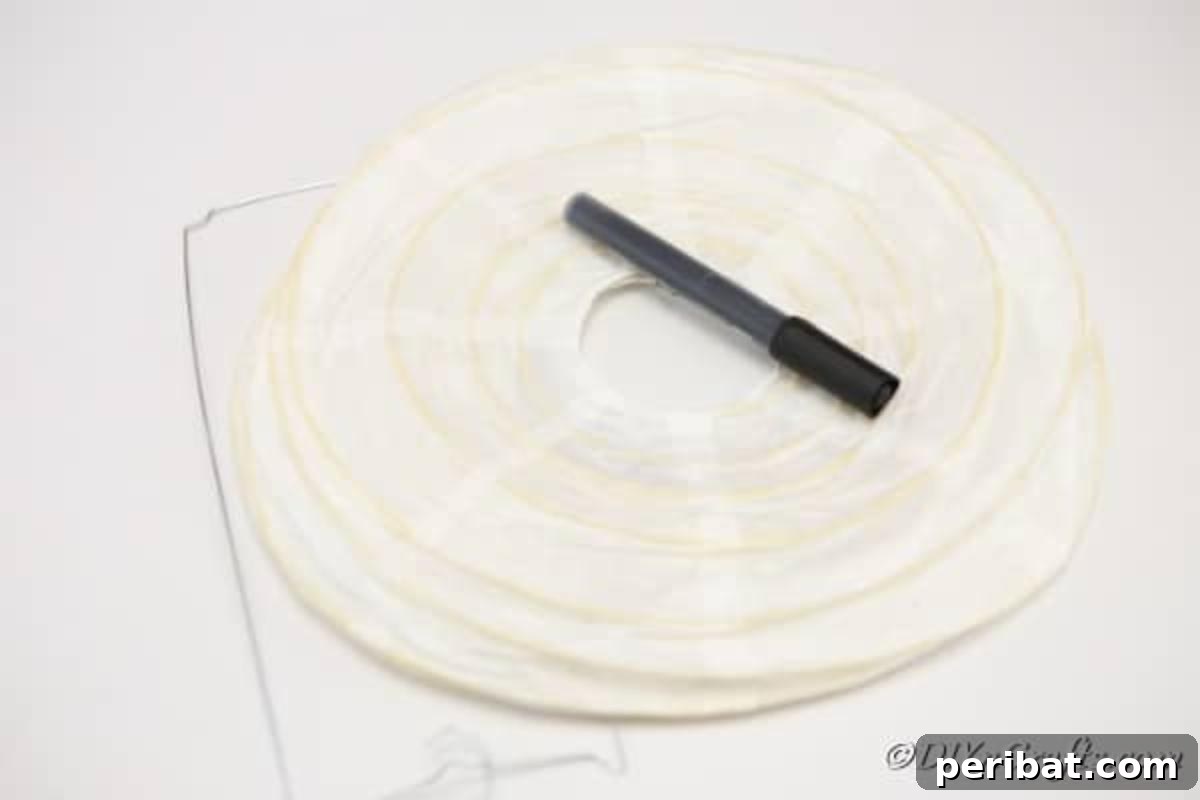 Hauntingly Simple Ghost Lanterns 6 Supplies for making ghost paper lanterns including marker and tealight