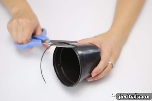 Craft a Charming Rustic Basket 12 Cutting the lip off the top of your flower pot for the woven basket