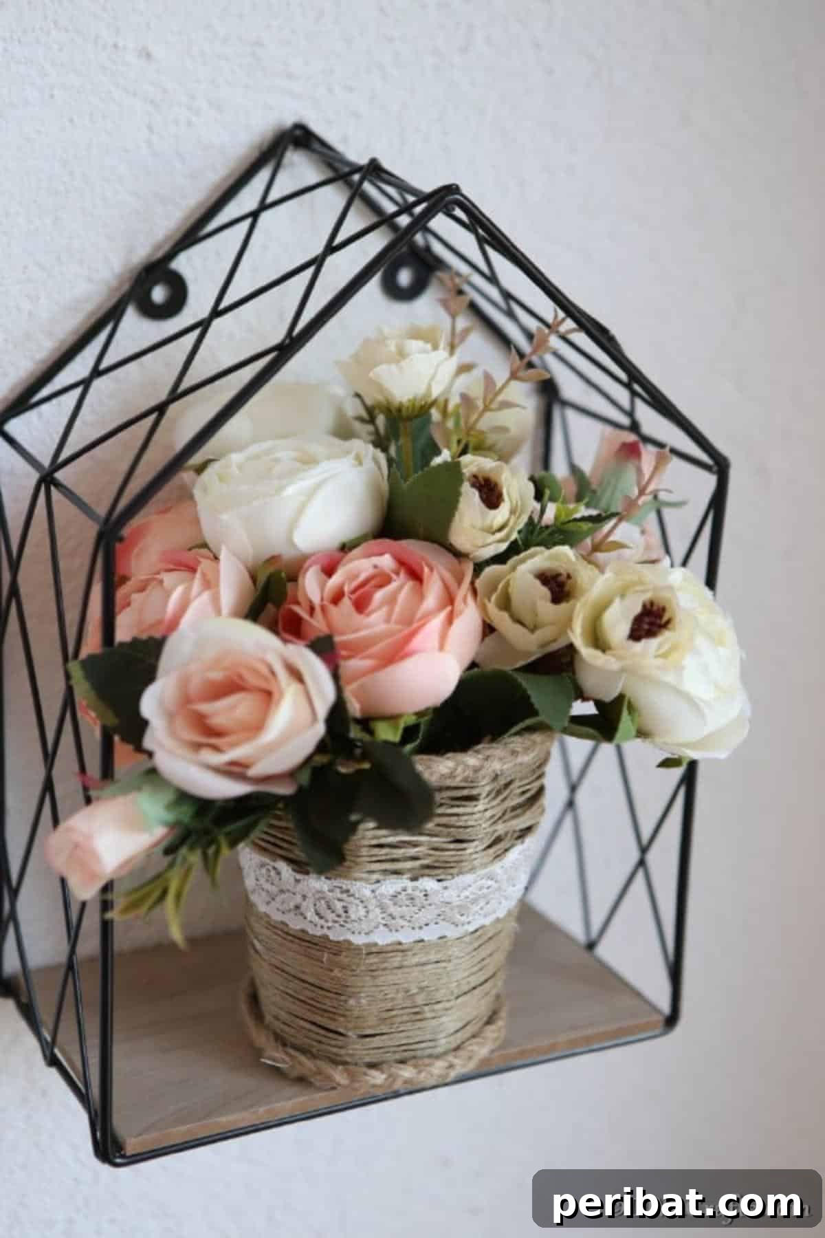 Craft a Charming Rustic Basket 4 Completed woven basket filled with flowers sitting inside a wire frame attached to the wall