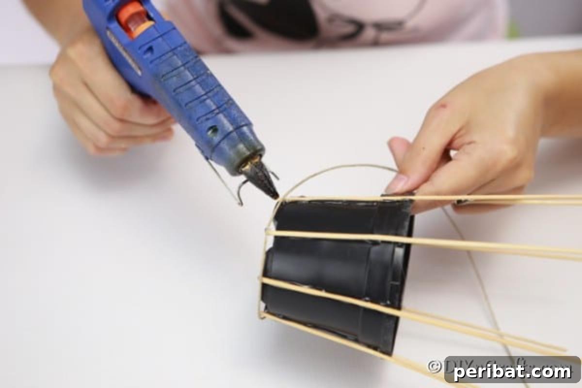 Craft a Charming Rustic Basket 8 Gluing dowels to the flower pot for making a woven basket