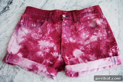 40 Smart & Easy DIY Shorts for Summer 27 DIY flowery tie-dyed denim cut-off shorts with tropical patterns