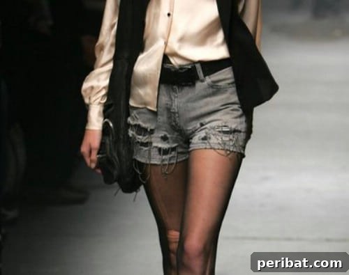 40 Smart & Easy DIY Shorts for Summer 9 DIY distressed denim shorts embellished with decorative chains