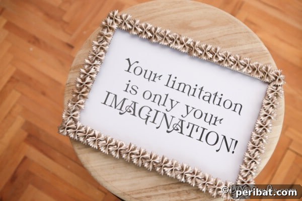 Overhead picture of a painted pasta picture frame craft