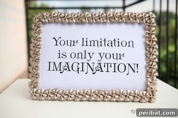 A printed quote inside a pasta painted macaroni art frame