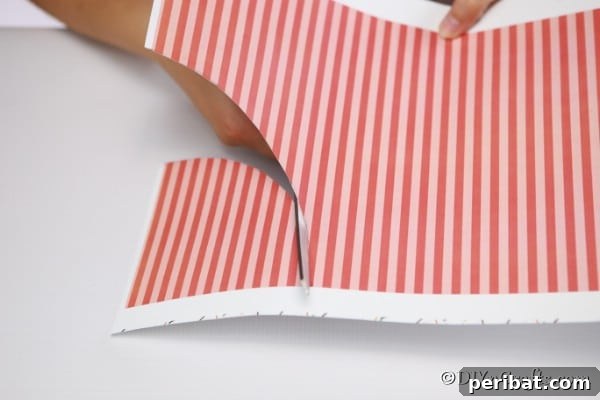 Enchanting Paper Gnome Homes for Your Garden 18 Cutting a half moon out of colored paper for the roof