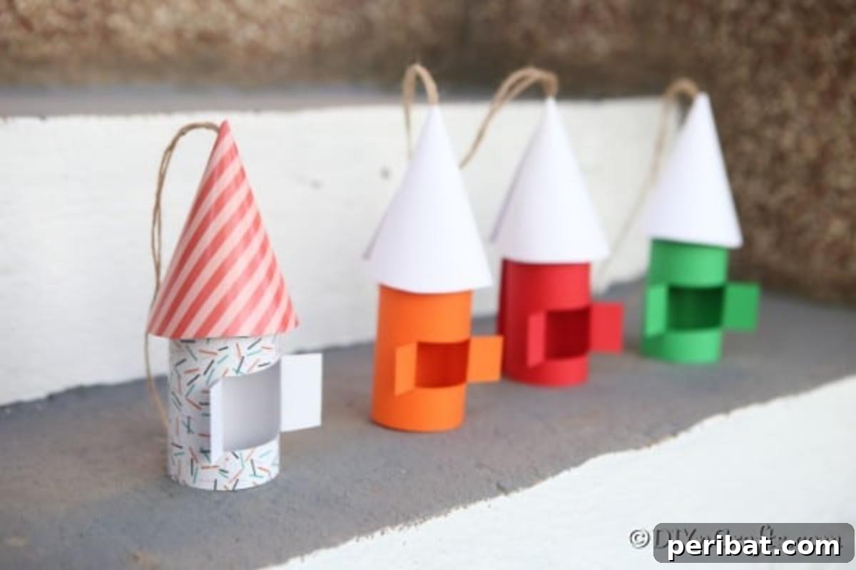 Enchanting Paper Gnome Homes for Your Garden 5 A row of colorful paper gnome houses on a concrete shelf, showcasing diverse designs