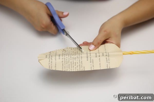 Cutting the paper into a feather shape