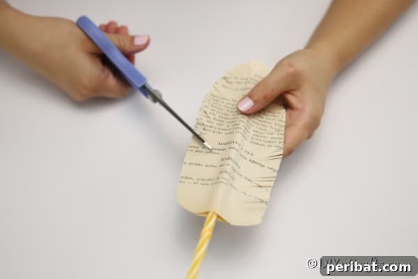 Cutting small feather fringe on old paper decorative feathers