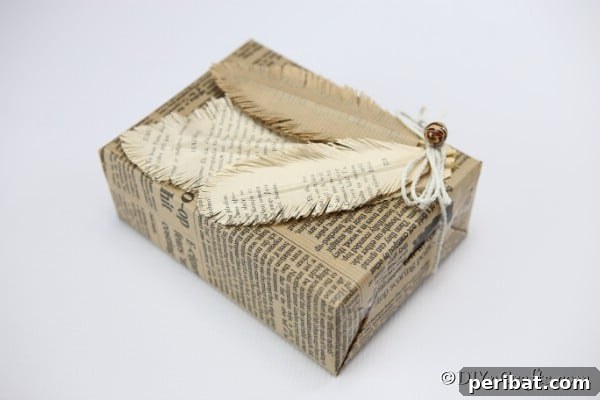A finished decorative feathers display on a newspaper covered package