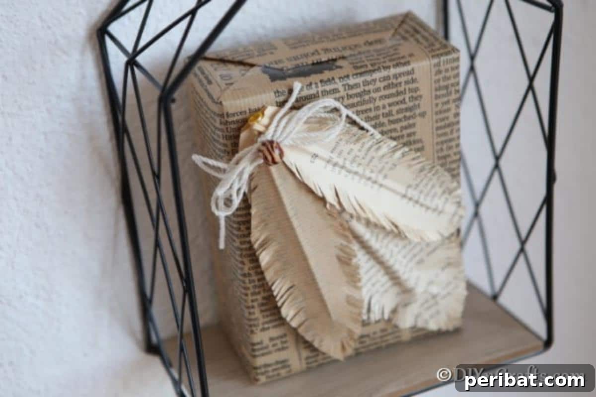 An up-close view of decorative feathers crafted from old book pages, arranged on a black wire shelf.