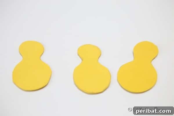 Whimsical Bee Garden Planter 17 Bee shaped yellow foam board laying on a white surface