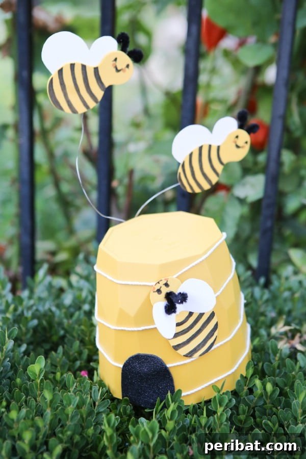 Whimsical Bee Garden Planter 23 A yellow flower pot bee garden decoration on the edge of a shrub