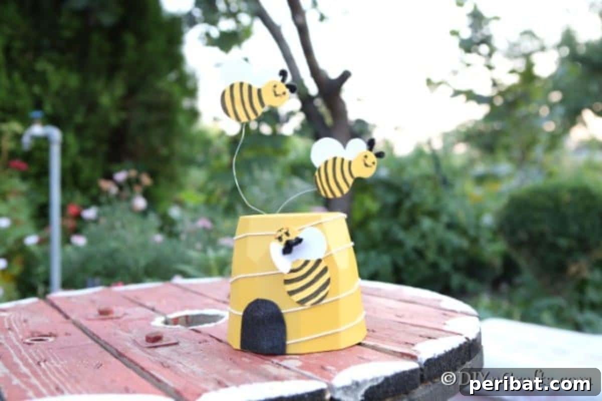 Whimsical Bee Garden Planter 5 A garden bee decoration on a wooden table