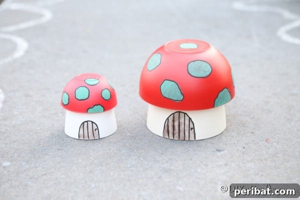 Whimsical Hand-Painted Mushroom Garden Planter 13 Two mushroom planter houses displayed proudly on a sidewalk, showcasing creative garden decor