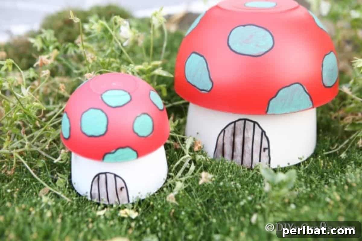 Whimsical Hand-Painted Mushroom Garden Planter 3 Two charming painted mushroom planter fairy houses nestled in green grass