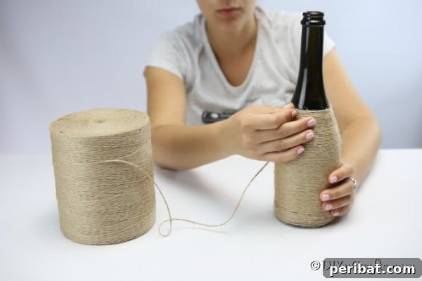 Coastal Rustic Wine Bottle Charm 13 Wrapping a wine bottle with twine to create a nautical decor piece