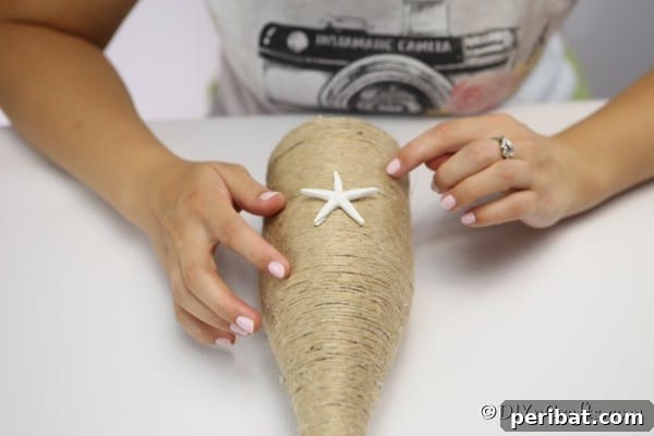 Coastal Rustic Wine Bottle Charm 14 Adding starfish to the twine wrapped bottle