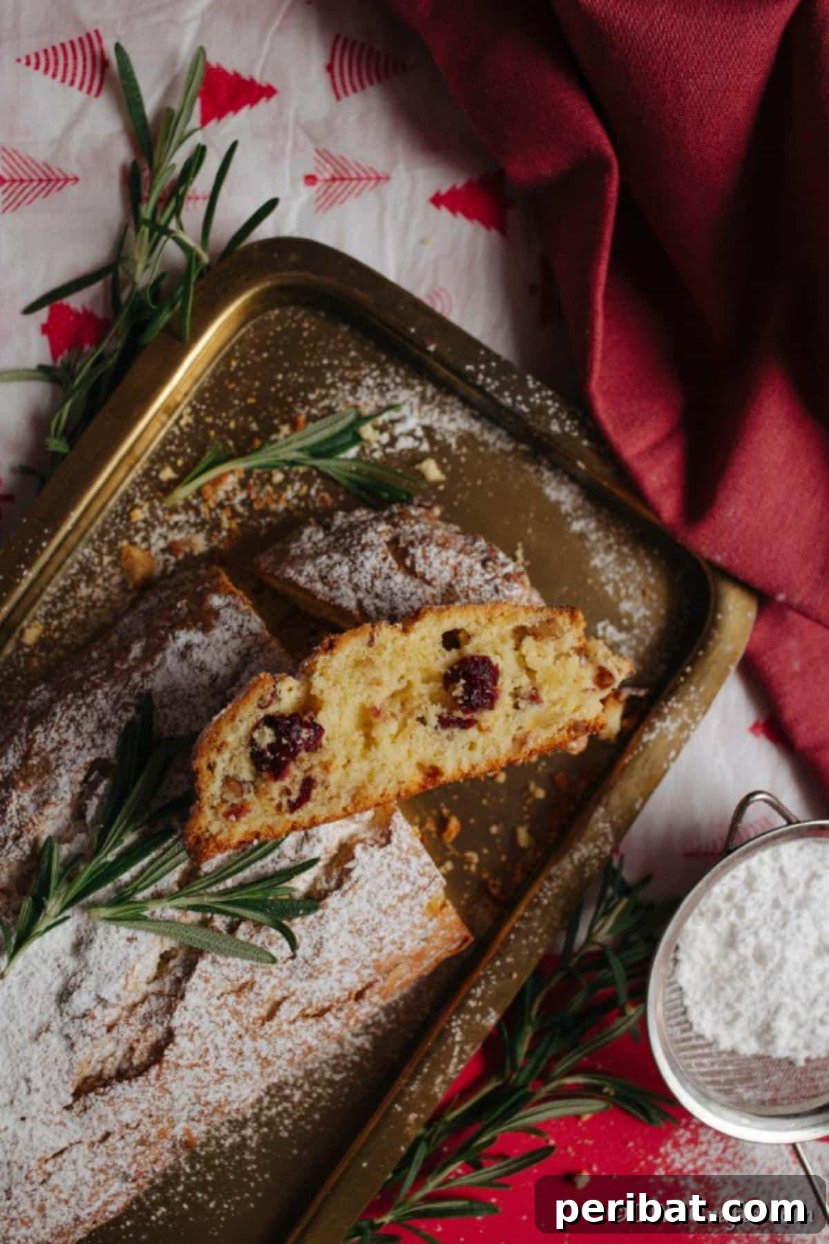 German Christmas Stollen Festive Bread Recipe 4 Overhead view of several slices of traditional German Christmas Stollen arranged on a white plate