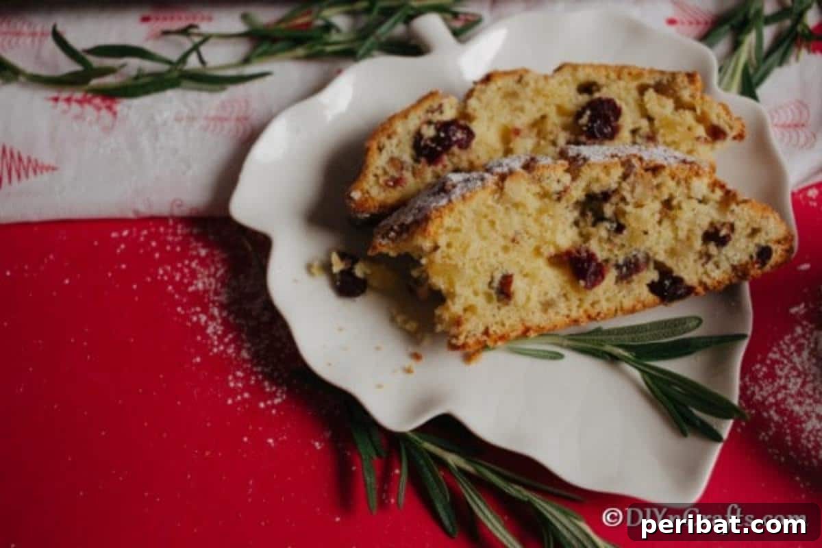 German Christmas Stollen Festive Bread Recipe 5 Slices of freshly baked Christmas Stollen arranged artfully on a white plate