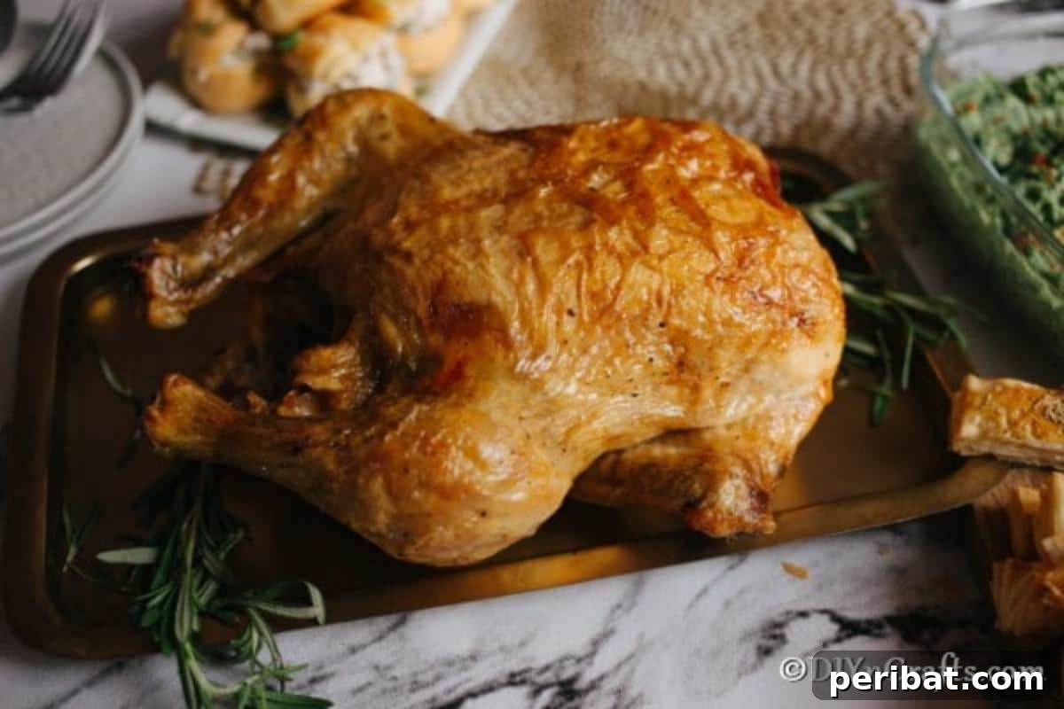 Golden Rosemary Roasted Chicken 5 Large roasted chicken on a serving platter