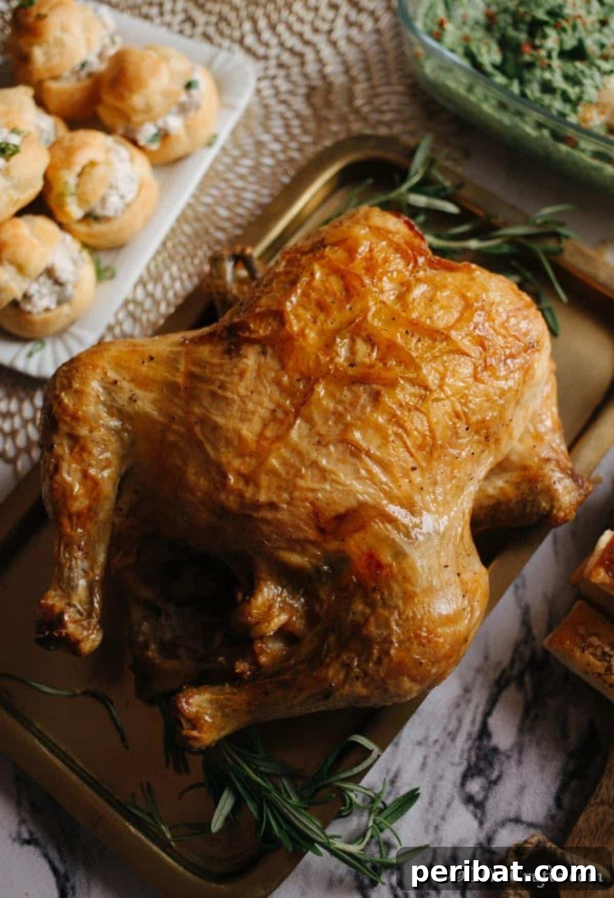 Golden Rosemary Roasted Chicken 6 Large oven roasted chicken breast with lemon and rosemary on a baking dish