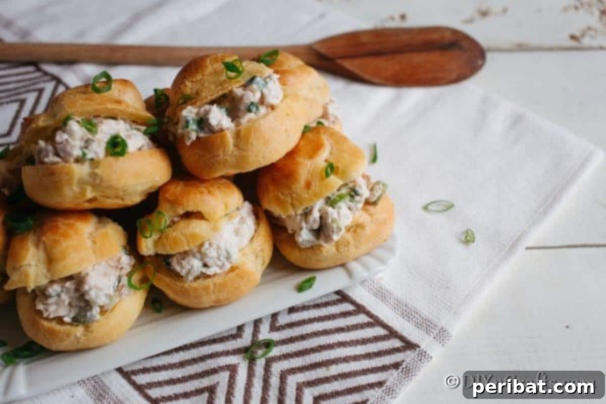 Golden Puffs, Creamy Chicken Salad 3 A platter of homemade chicken salad sandwiches ready to serve