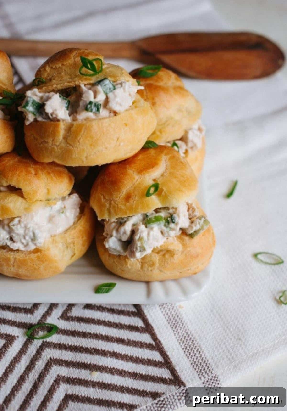 Golden Puffs, Creamy Chicken Salad 8 Puff pastry with chicken salad filling on a white counter