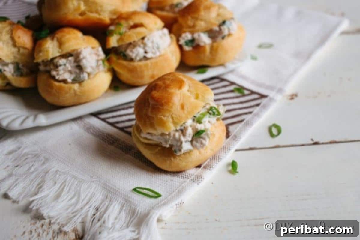 Golden Puffs, Creamy Chicken Salad 9 A platter filled with puff pastry and chicken salad sandwiches