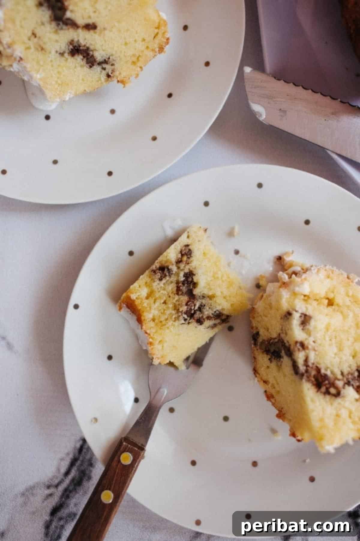 Sweet Surprise Sock It To Me Cake 4 A slice of sock it to me cake on a white polka dot plate
