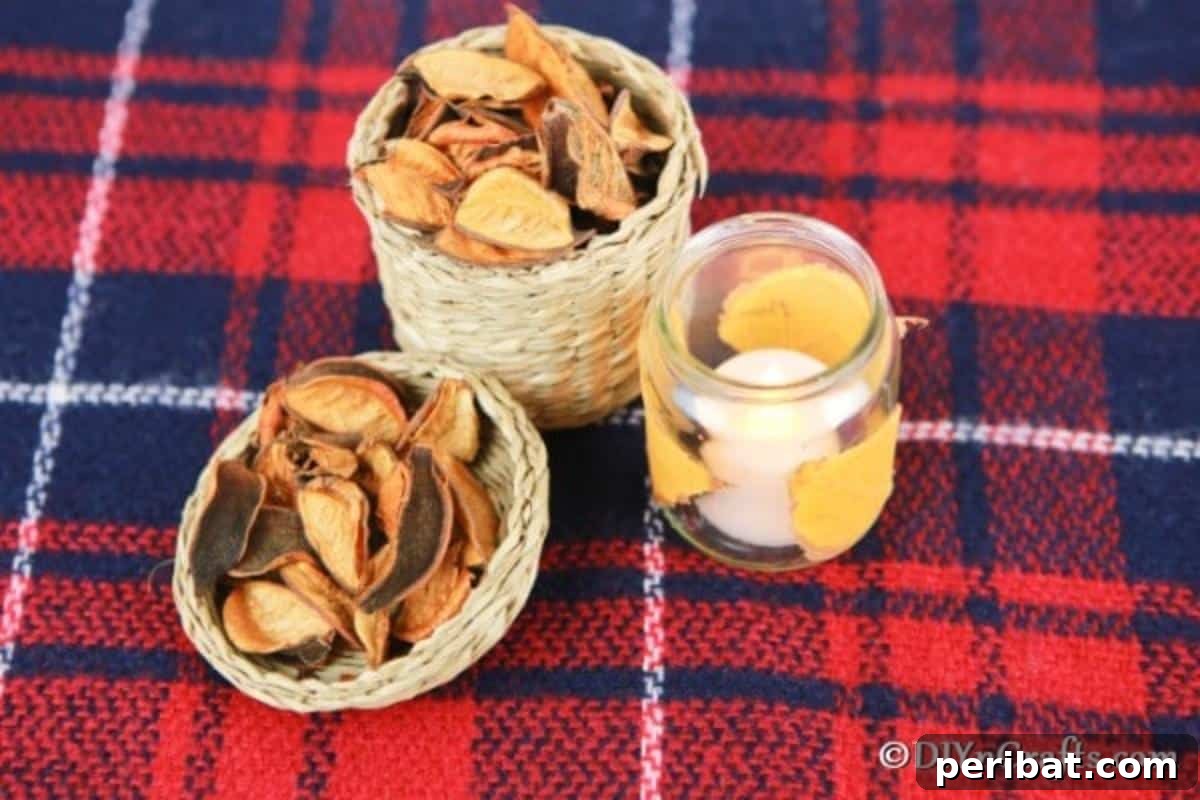 Overhead picture of fall leaf candle lanterns displayed on red plaid cloth, highlighting their warmth and charm