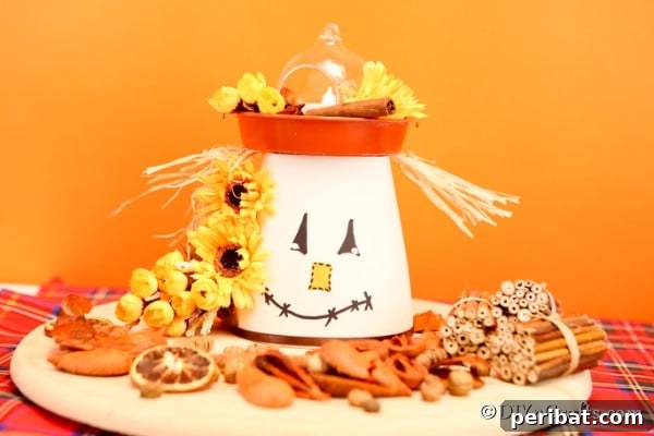 Whimsical Scarecrow Pot Lantern 12 A fully assembled DIY scarecrow flower planter lantern, with a warm internal glow, positioned against an inviting orange background, capturing the essence of fall decor.