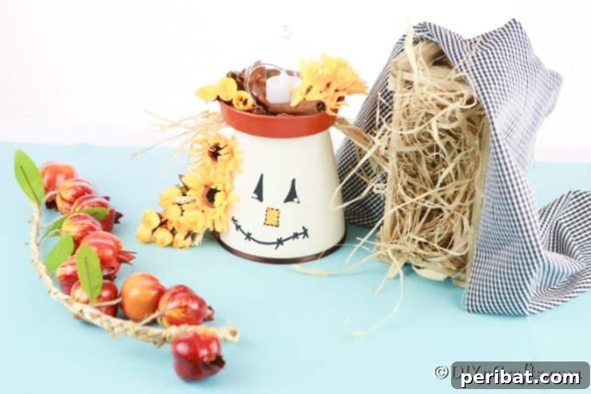 Whimsical Scarecrow Pot Lantern 3 A beautifully crafted DIY scarecrow clay pot lantern displayed on a blue countertop, surrounded by rustic fall elements like pinecones and autumn leaves, highlighting its versatility as seasonal decor.