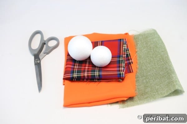 All supplies needed for making a delightful cloth pumpkin ornament as fall decor, neatly arranged on a crafting table, ready to begin the DIY project