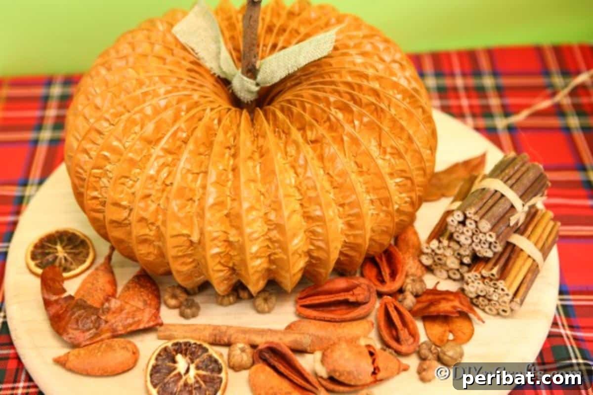 Easy DIY Dryer Vent Pumpkins Video Tutorial Included 5 Dryer vent pumpkin sitting on a wooden board with fall decor items beside it