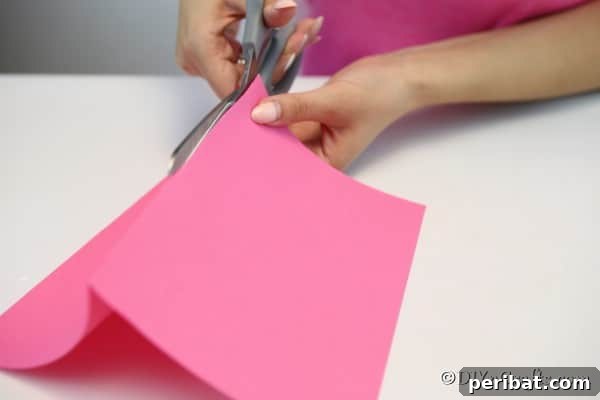 Folding and cutting paper for a fan garland