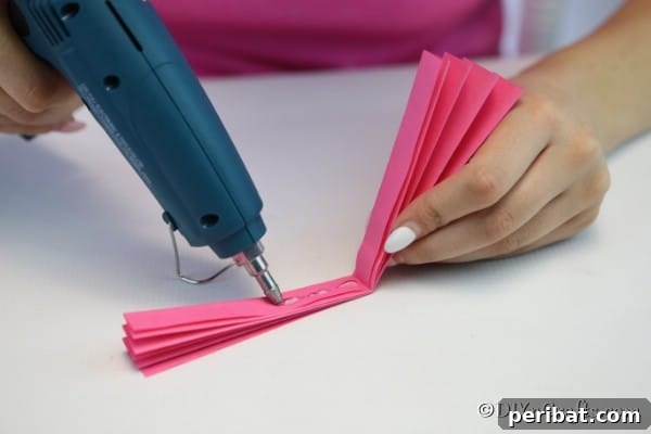 Gluing paper fan ends together