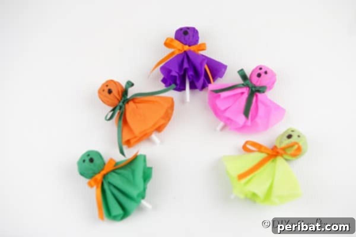 A pristine white table showcasing a delightful array of lollipop ghosts in multiple colors, each with unique facial expressions, awaiting Halloween festivities.