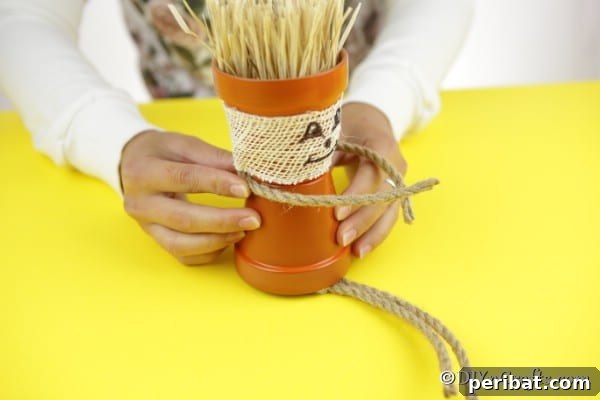 Adding arms and legs ropes to the flower pot people scarecrow