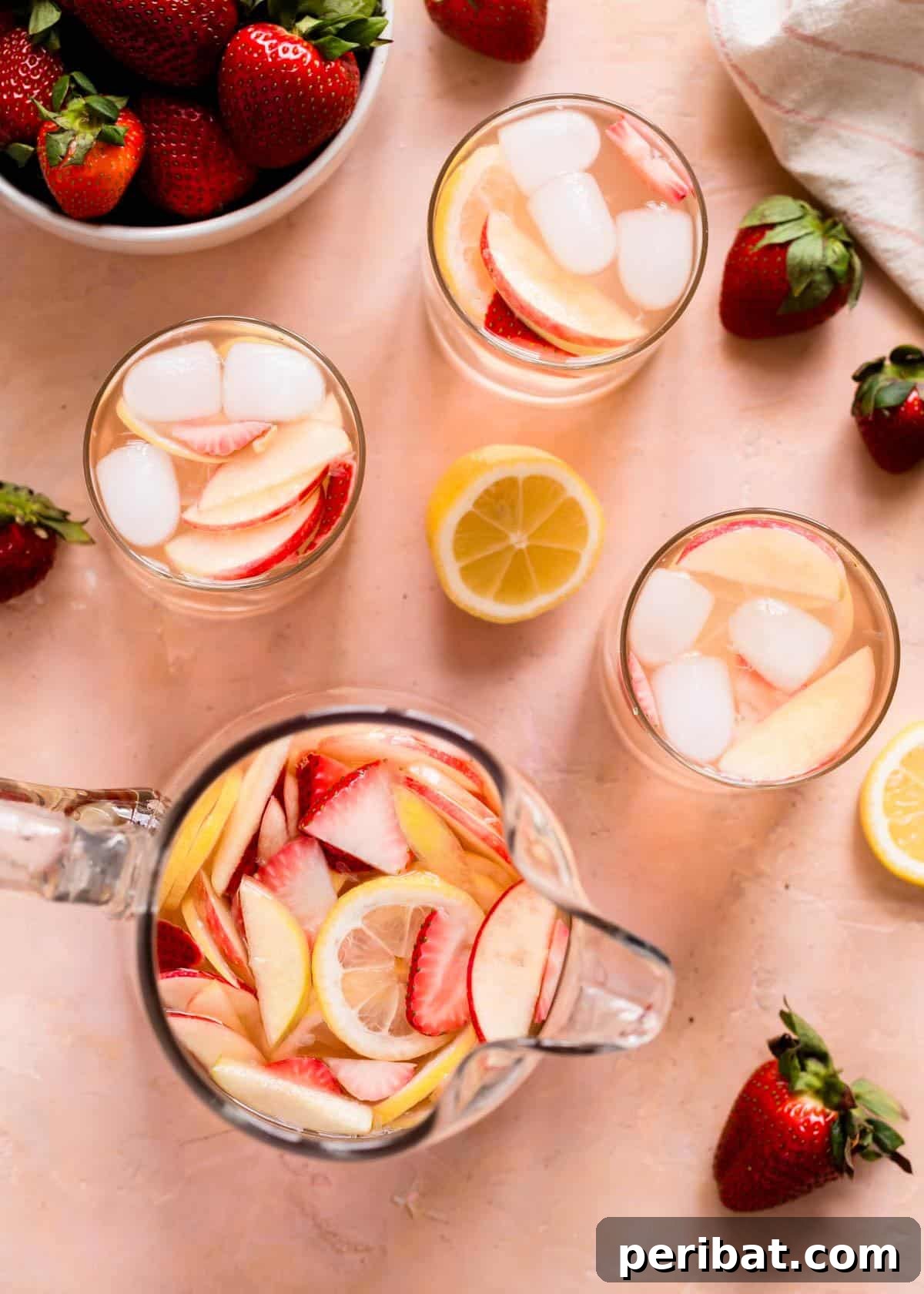 40 Ultimate Summer Sips to Beat the Heat 3 White Strawberry Lemon Sangria