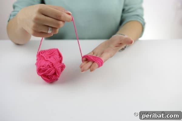 Yarn Pom-Pom Floral Displays 15 Wrapping yarn around your palm to create a yarn pom poms flower