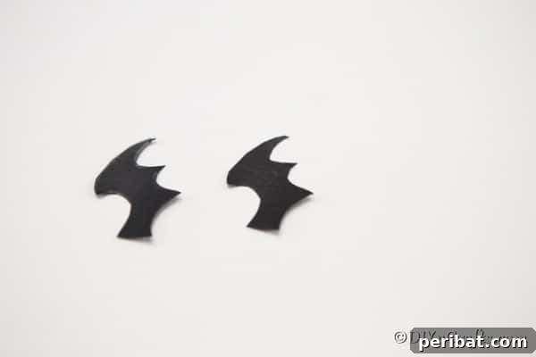 Spooky Fun Clothespin Bats for Halloween 12 Multiple bat wings neatly cut from black paper, ready for assembly