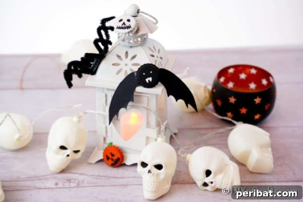 Fun magnets for Halloween on a white counter with plastic skulls and lanterns