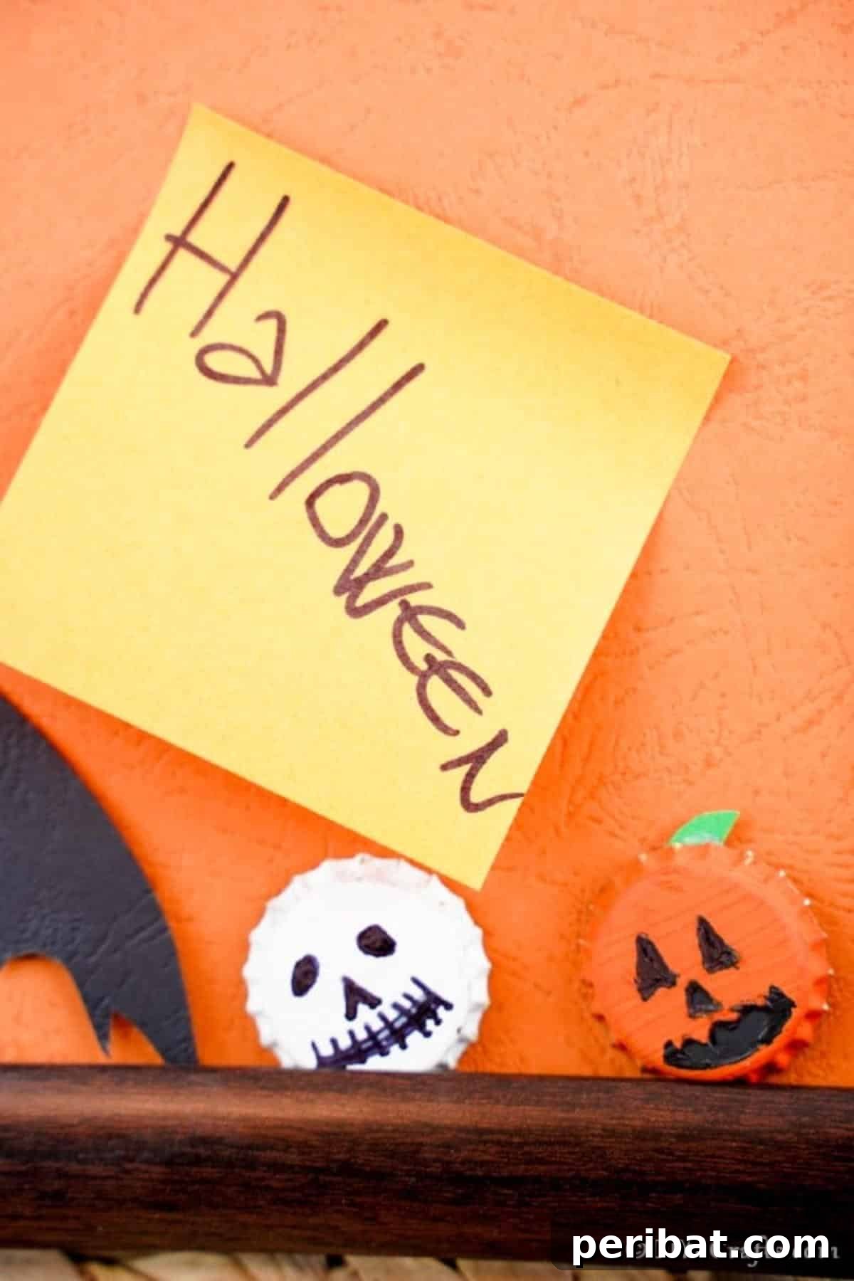 Halloween fun ghost and pumpkin magnets up close on a picture frame