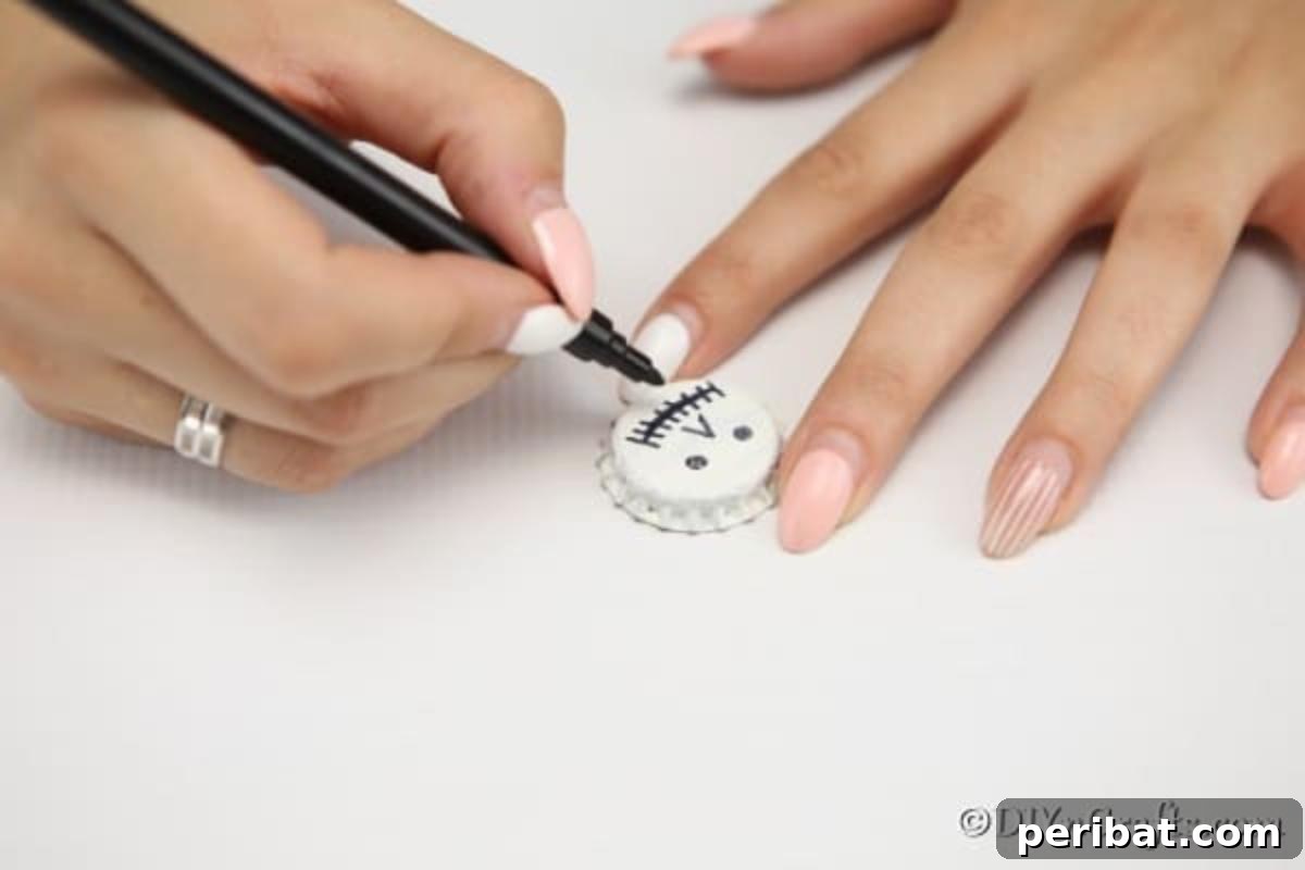 Drawing faces on the bottle caps for the fun magnets