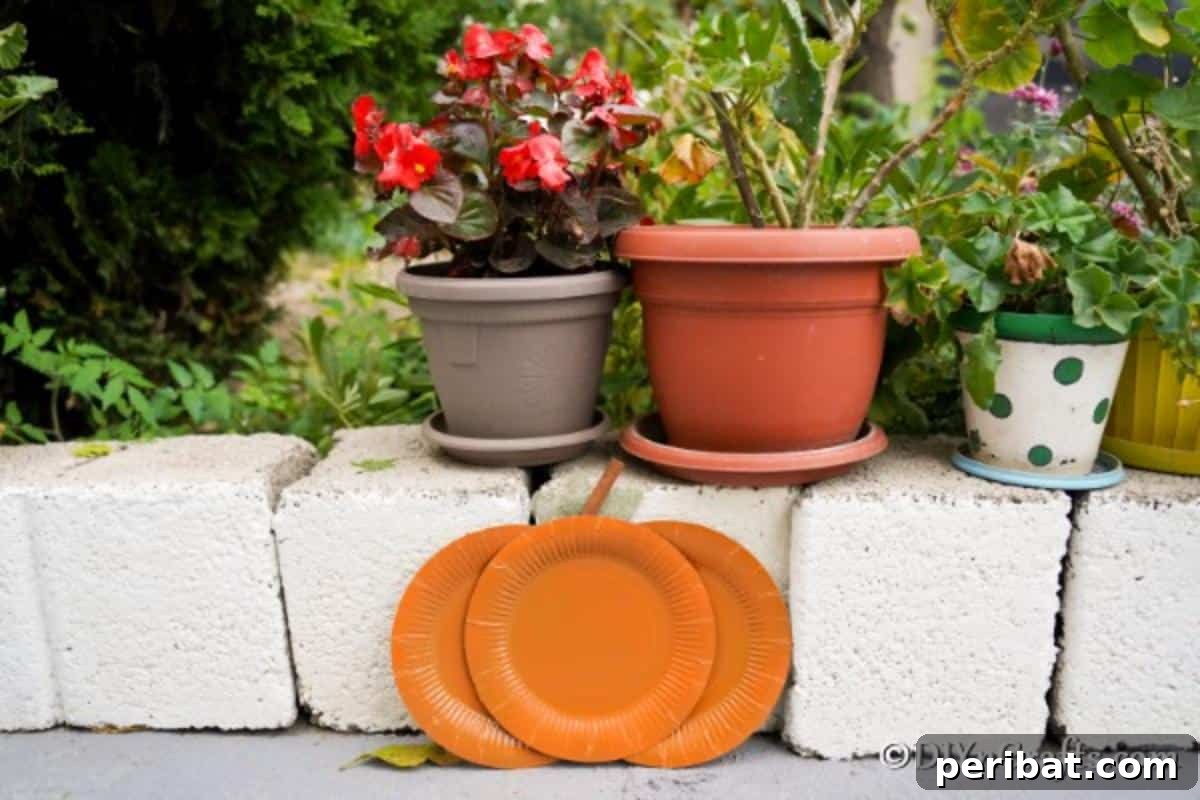 Fall Paper Plate Pumpkin Fun 3 A handcrafted paper plate pumpkin craft leaning casually against a textured block wall outdoors, showcasing its rustic charm against a natural backdrop.