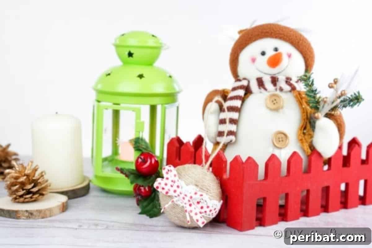Rustic Christmas ornament with lace and twine on a counter next to other holiday decorations