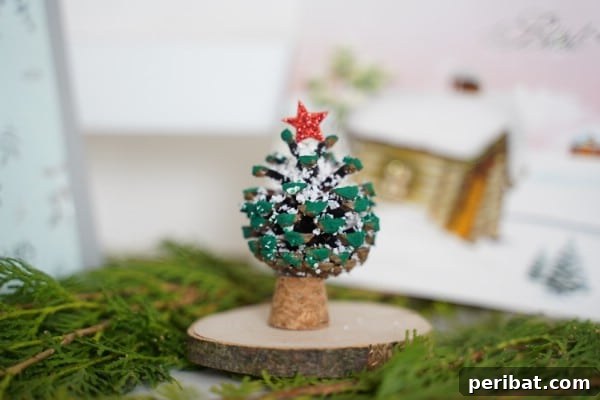 Beautiful miniature pinecone Christmas tree ornament ready for display