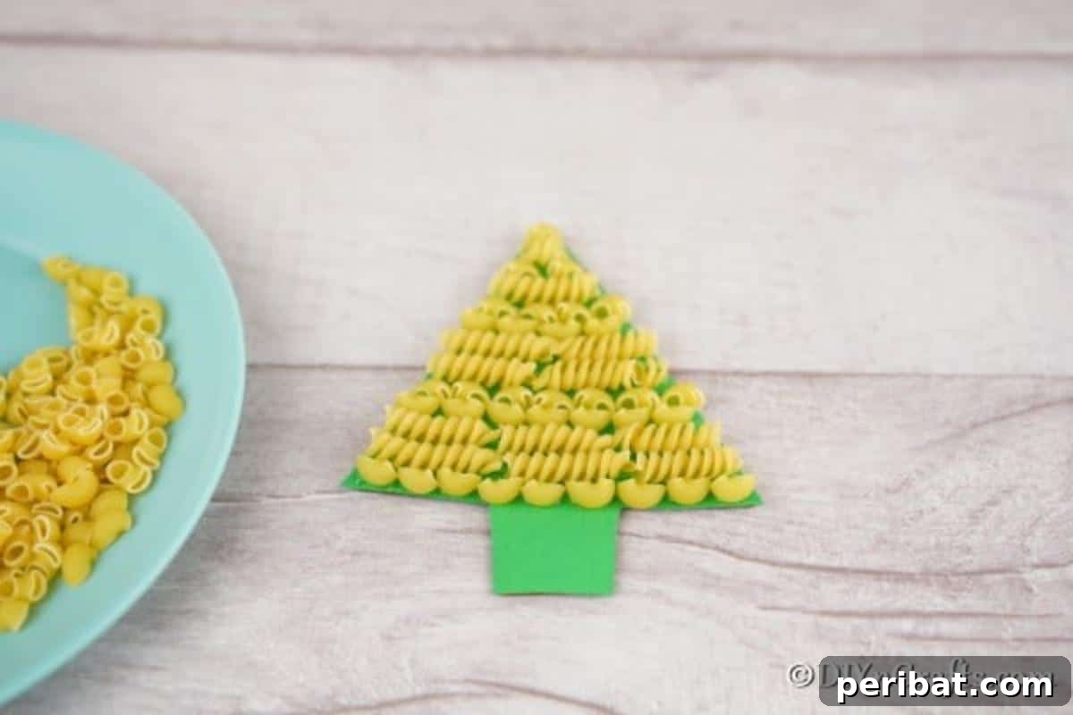 Whimsical Pasta Christmas Tree Decor 10 Gluing pasta to a christmas tree craft